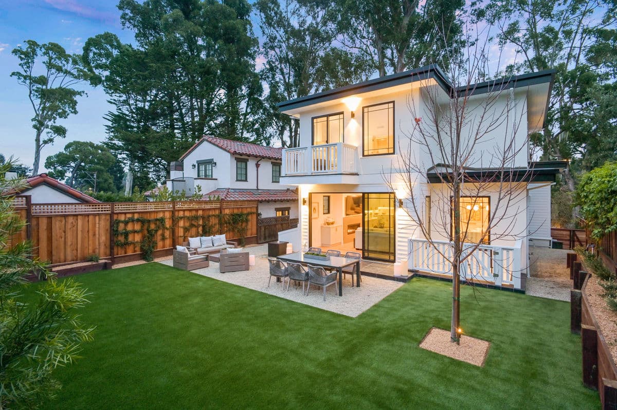 Two-story home exterior painting with backyard patio Bay Area